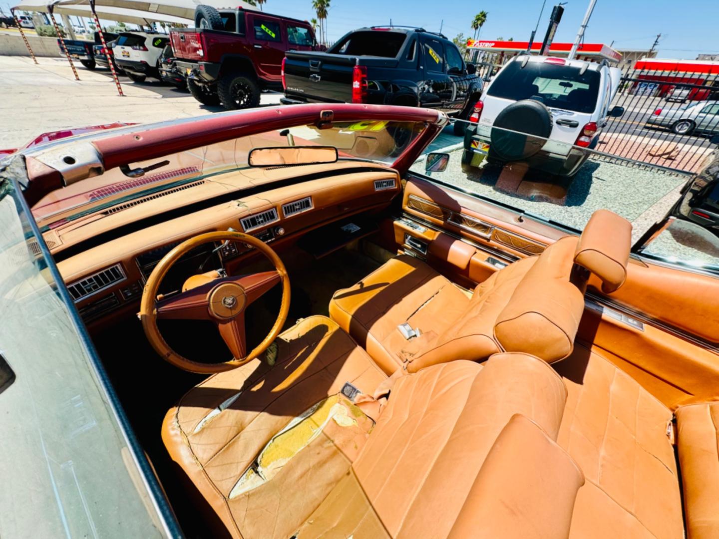 1975 Red Cadillac Eldorado convertible. , located at 2190 Hwy 95, Bullhead City, AZ, 86442, (928) 704-0060, 0.000000, 0.000000 - 1975 Cadillac Eldorado Convertible. Great project car for someone. New tires. Runs and drives, power top works. has a/c doesn't work. needs restoration. interior needs work, engine needs to be serviced . clear title. - Photo#4